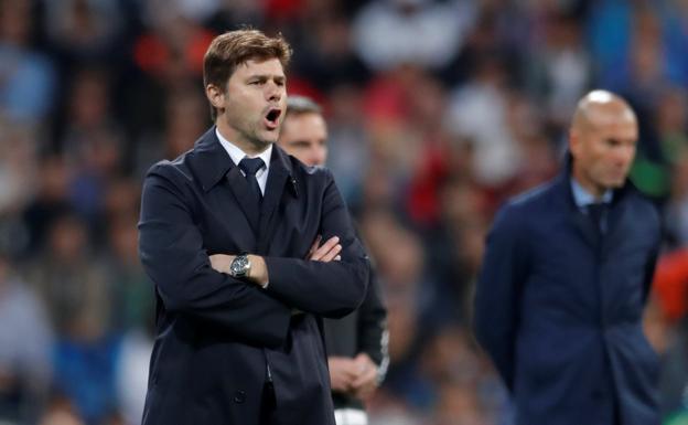 Pochettino, con Zidane al fondo./Reuters