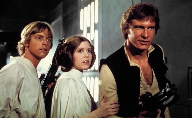 Mark Hamill, Carrie Fisher y Harrison Ford en una escena de la Guerra de las Galaxias Episodio IV./
