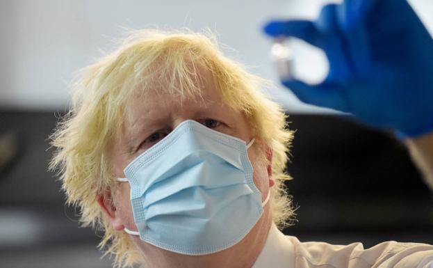 Boris Johnson, with a dose of the coronavirus vaccine.
