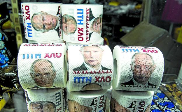 The great villain.  Vladimir Putin's face decorates toilet paper rolls at a kyiv souvenir shop.