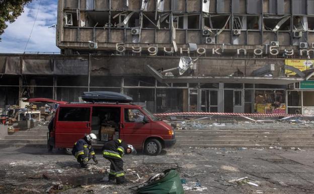 Firefighters collect debris from one of the explosions in Vinnitsa 