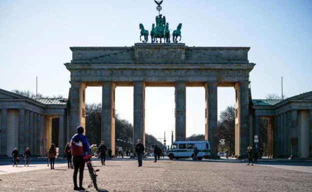 Pedestrians near the Brandenburg Gate in Berlin. 