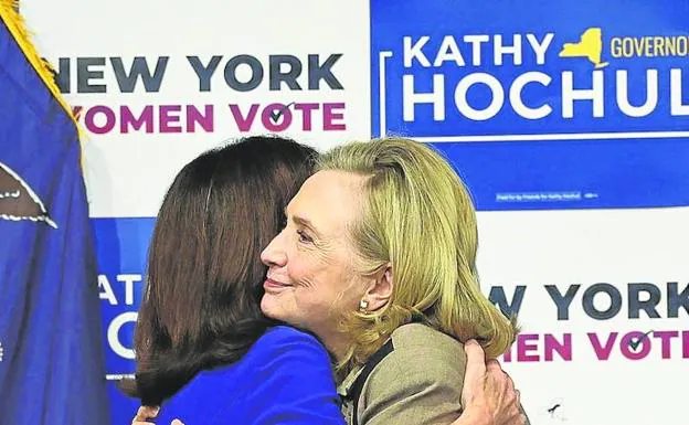 Hillary Clinton hugs Kamala Harris at Barnard College.