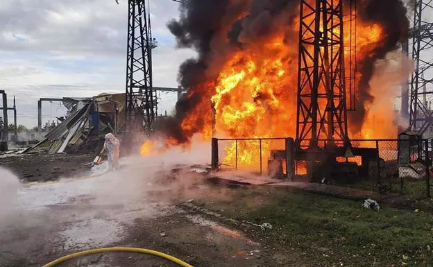 Firefighters put out the fire after the Russian attack on a Ukrainian power plant.