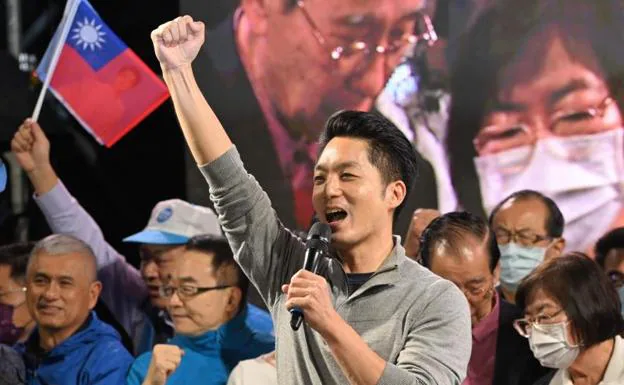 Opposition Kuomintang party candidate Chiang Wan-an celebrates his election victory at a rally in Taipei. 