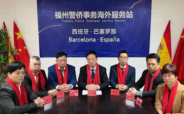 Members of a Chinese 'police station' on the day of its inauguration in Barcelona. 