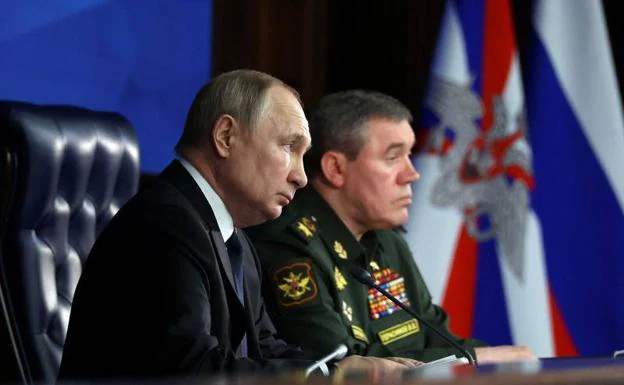 Russian President Vladimir Putin and Russian Armed Forces Chief of Staff Valeri Gerasimov attend the annual meeting of the Defense Ministry Board in Moscow on Wednesday.