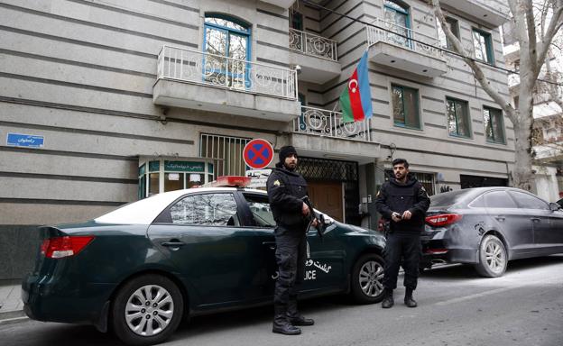 Iranian Police stand guard outside the Azerbaijani Embassy in Tehran after the attack